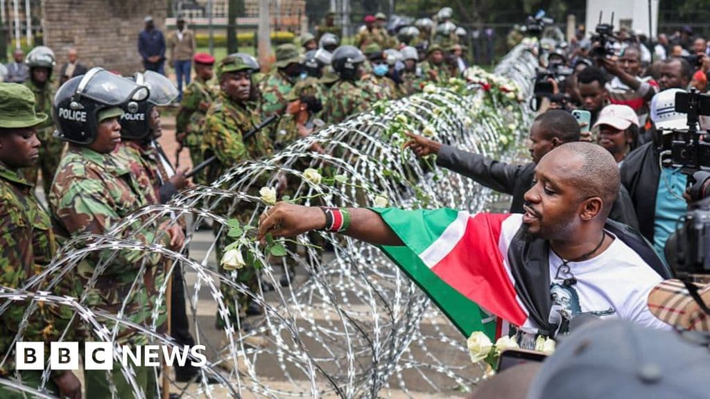 families-lay-flowers-on-barbed-wire-barricade-on-anniversary-of-deadly-kenya-protests